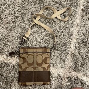 Women’s brown signature crossbody Coach bag